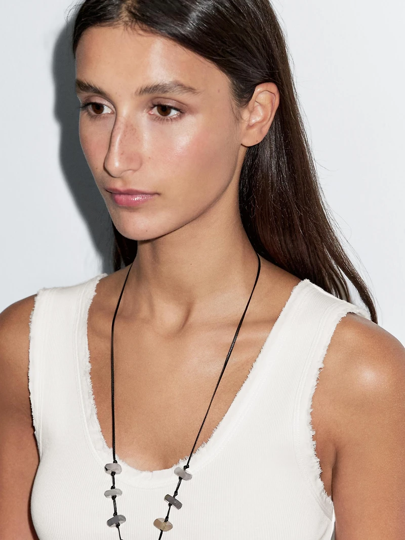 Top avec liseré effiloché en coton mélangé