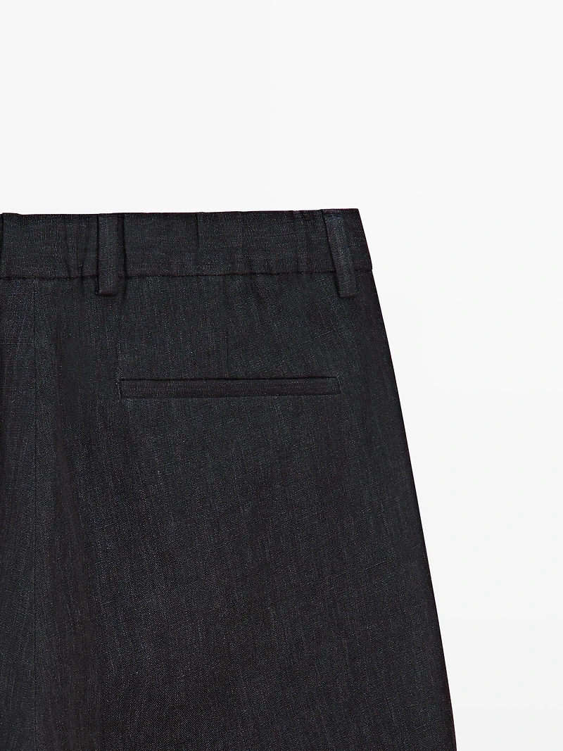 Total look linen trousers with flecked detail