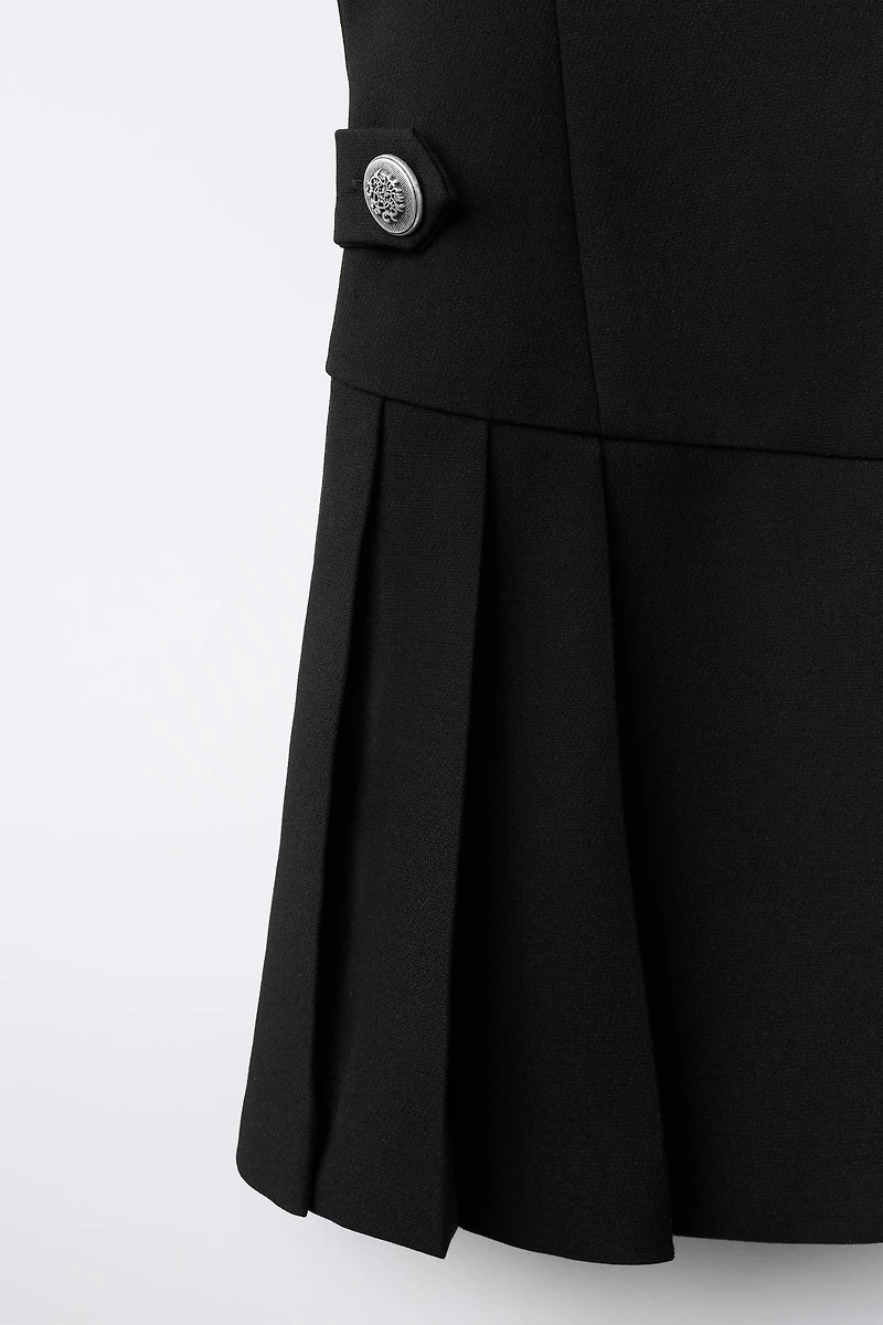 ROBE DÉTAIL PLIS PLATS