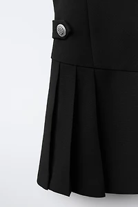 ROBE DÉTAIL PLIS PLATS