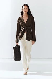 Flowing blouse with draped detail