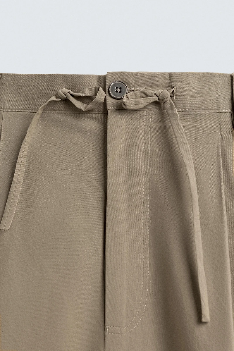 BALLOON FIT PLEATED PANTS