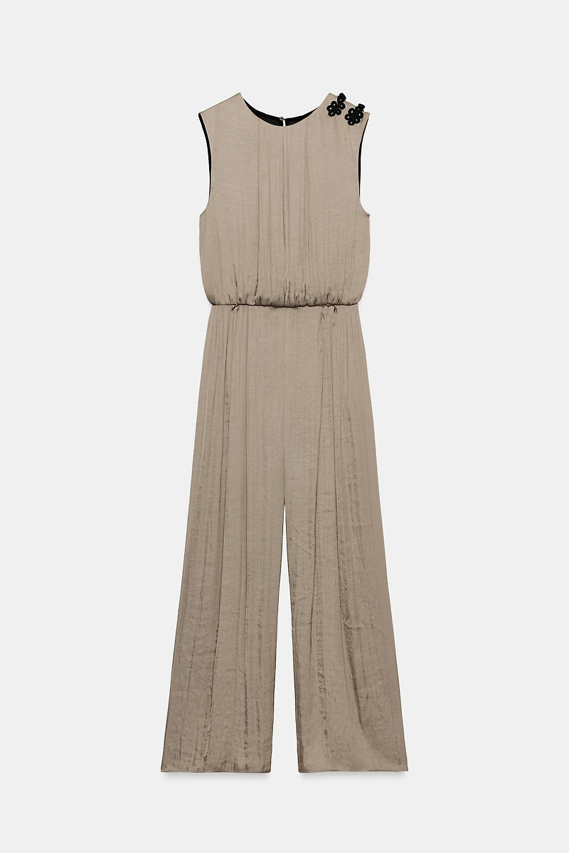 SATIN JUMPSUIT WITH SHOULDER FROG FASTENING