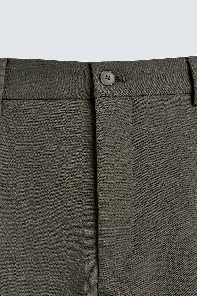 RELAXED FIT PLEATED PANTS