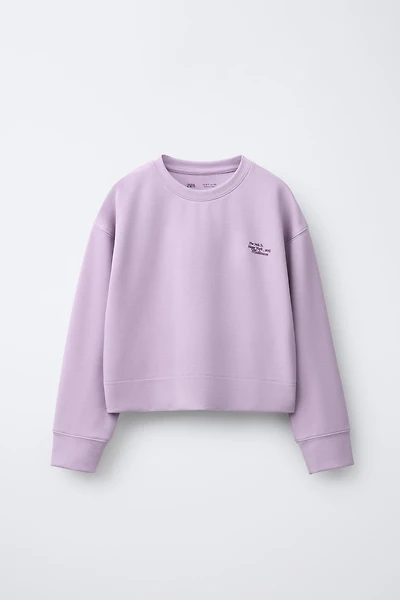 SWEATSHIRT WITH MODAL TEXT