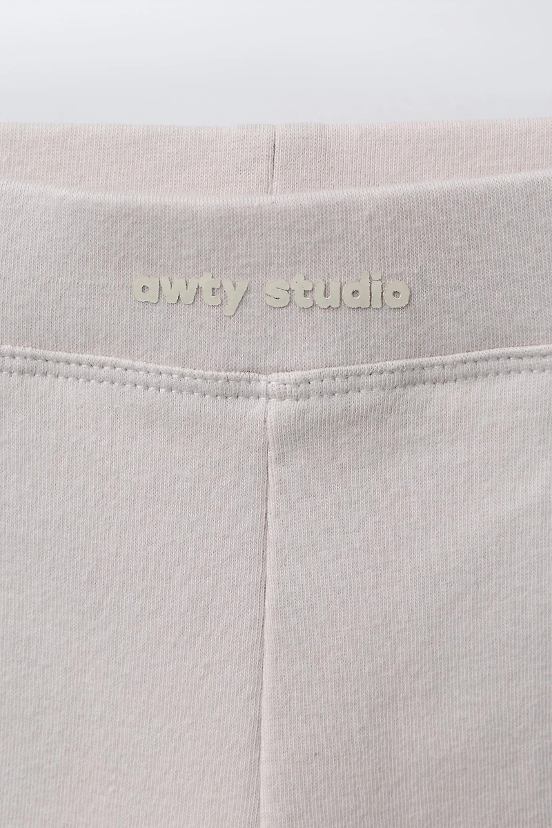 PLUSH FLARE PANTS WITH RAISED TEXT