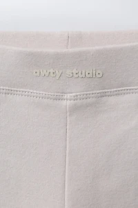 PLUSH FLARE PANTS WITH RAISED TEXT