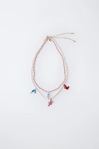 LOT DE DEUX COLLIERS PERLES ET FANTAISIE MER