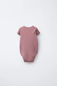 FIVE-PACK OF SWAN BODYSUITS