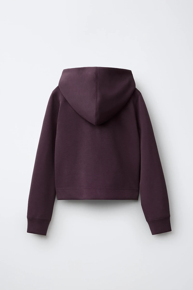 VESTE DE SPORT À CAPUCHE