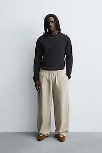 BALLOON FIT PLEATED PANTS