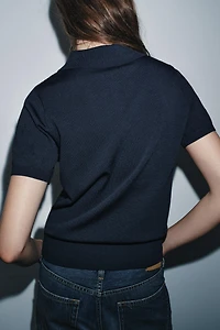 TOP POLO EN MAILLE MANCHES COURTES
