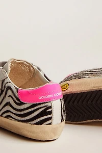 Super-Star Junior de piel y efecto potro con estampado cebra refuerzo del talón fucsia