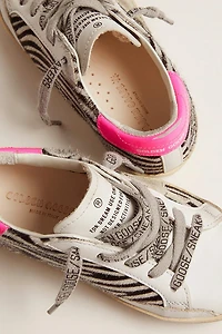 Super-Star Junior de piel y efecto potro con estampado cebra refuerzo del talón fucsia