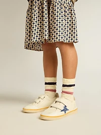 Junior Ball star with blue glitter and beige suede heel tab
