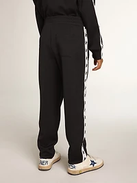 Dark blue joggers with white strip and contrasting stars