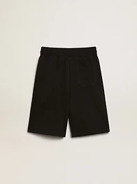 Boys’ black Bermuda shorts with white stars