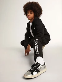 Black hooded sweatshirt with contrasting white star and logo