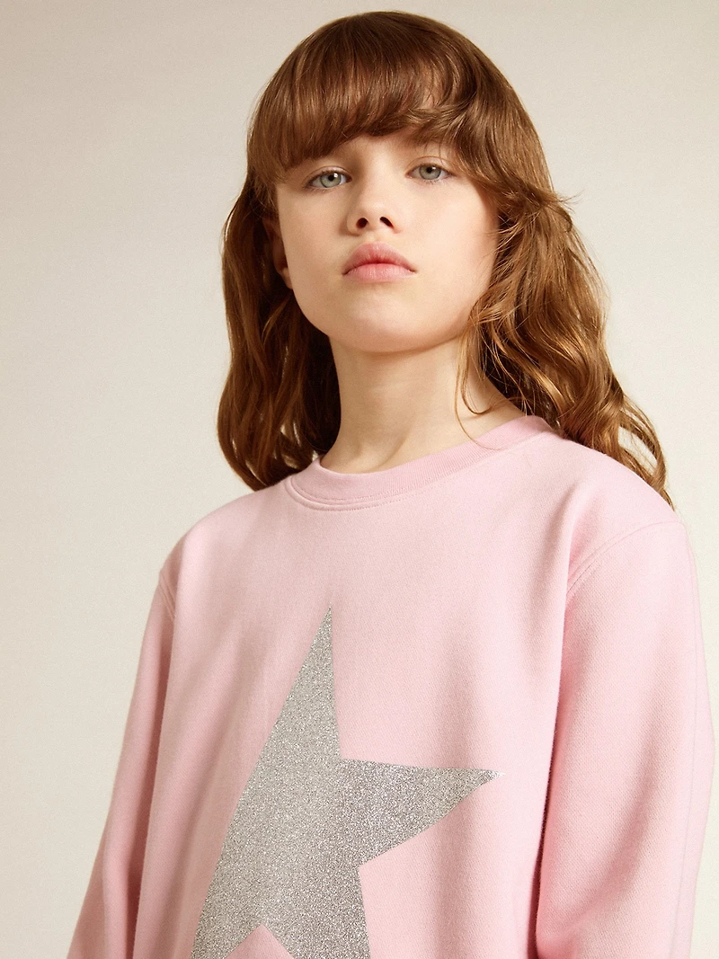 Pink sweatshirt with maxi star silver glitter on the front