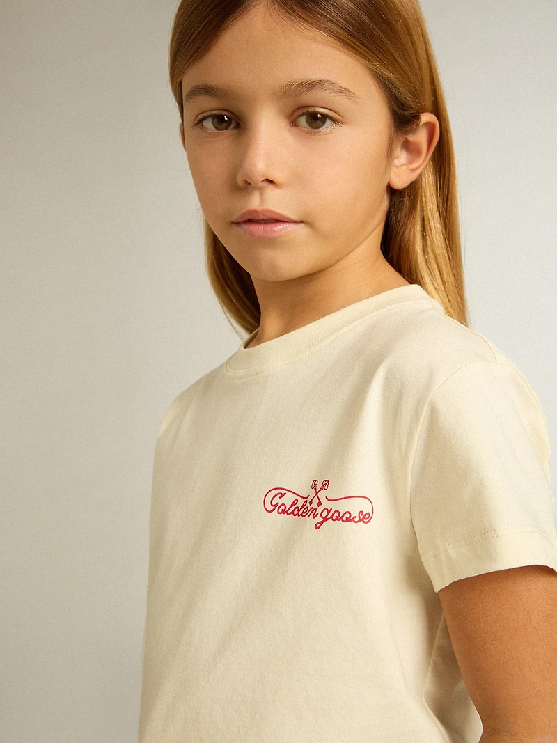 Girls' cotton T-shirt worn white with red embroidery on the chest