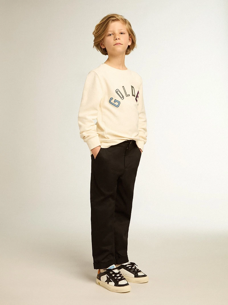Sweatshirt aged white with multicolor Golden lettering on the front