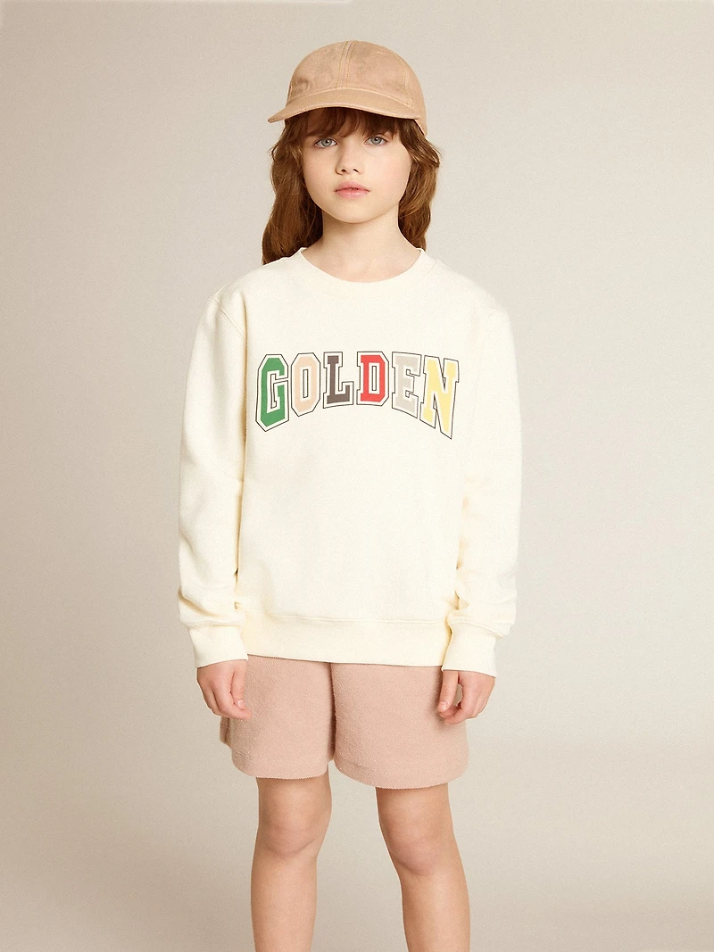 Sweatshirt aged white with multicolor Golden lettering on the front