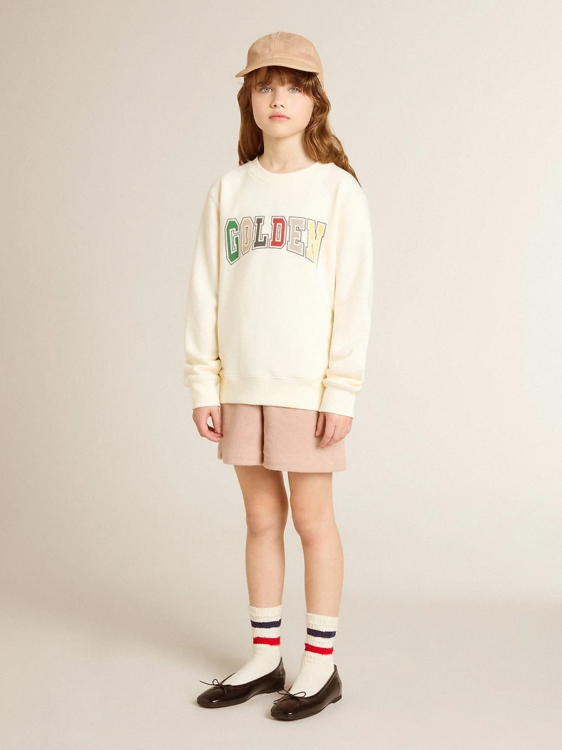 Sweatshirt aged white with multicolor Golden lettering on the front