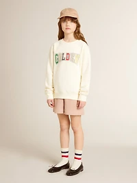 Sweatshirt aged white with multicolor Golden lettering on the front