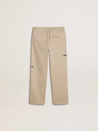 Kids’ beige chino pants with multicolor splashes