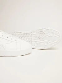 White Purestar sneakers with fluorescent orange heel tab