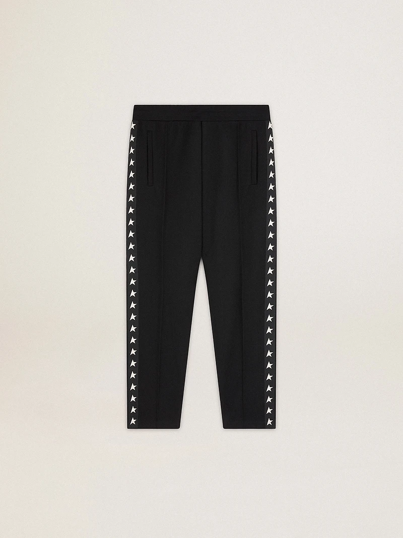 Men's black joggers with white stars on the sides