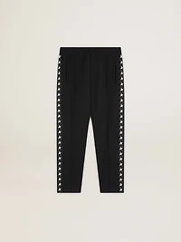 Men's black joggers with white stars on the sides