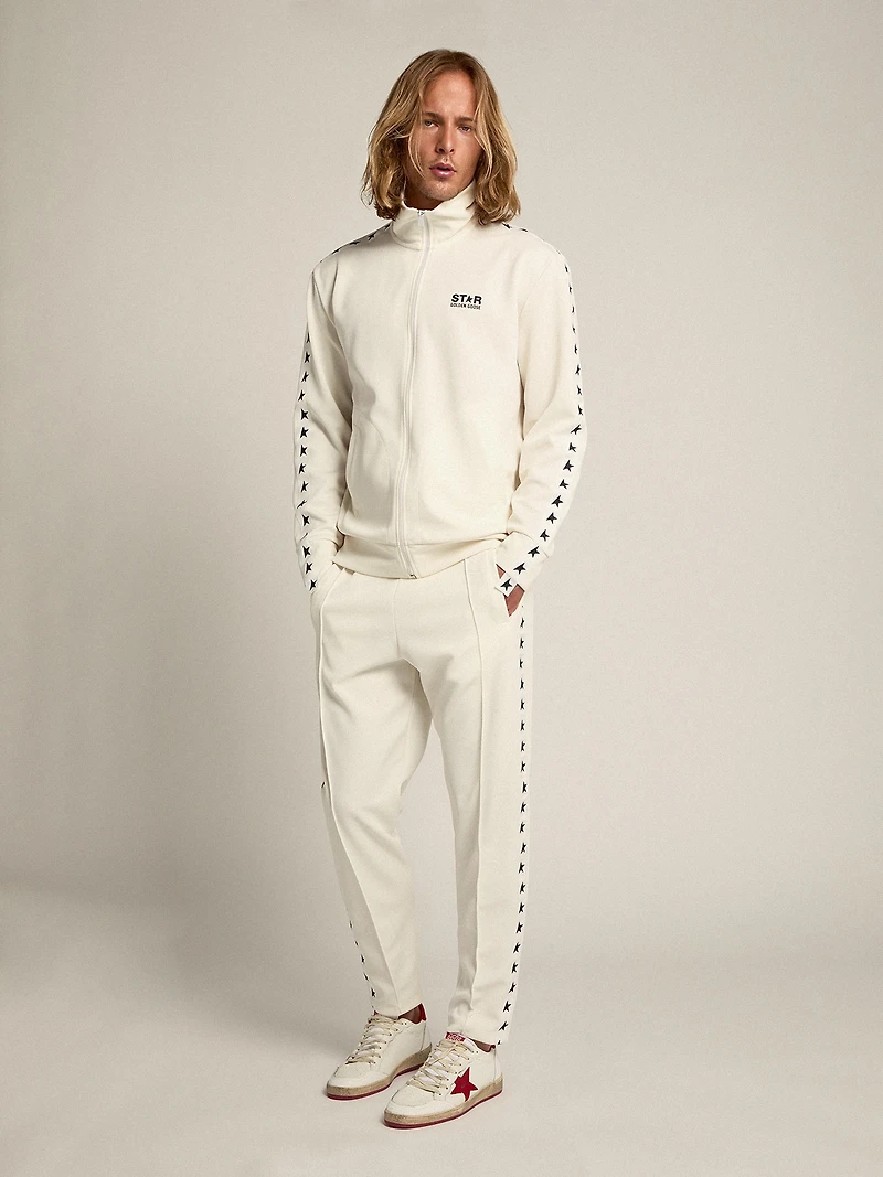 Men's white joggers with black stars on the sides