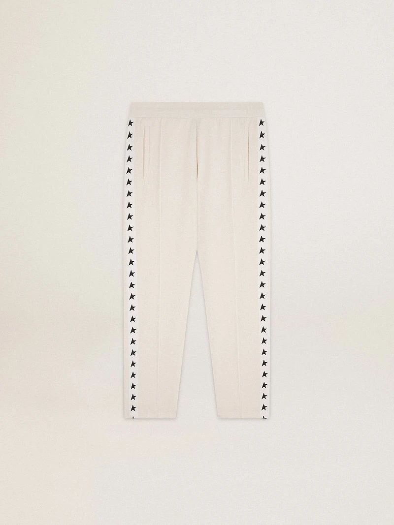 Men's white joggers with black stars on the sides