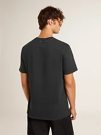 Men’s worn-black cotton T-shirt with print on the front