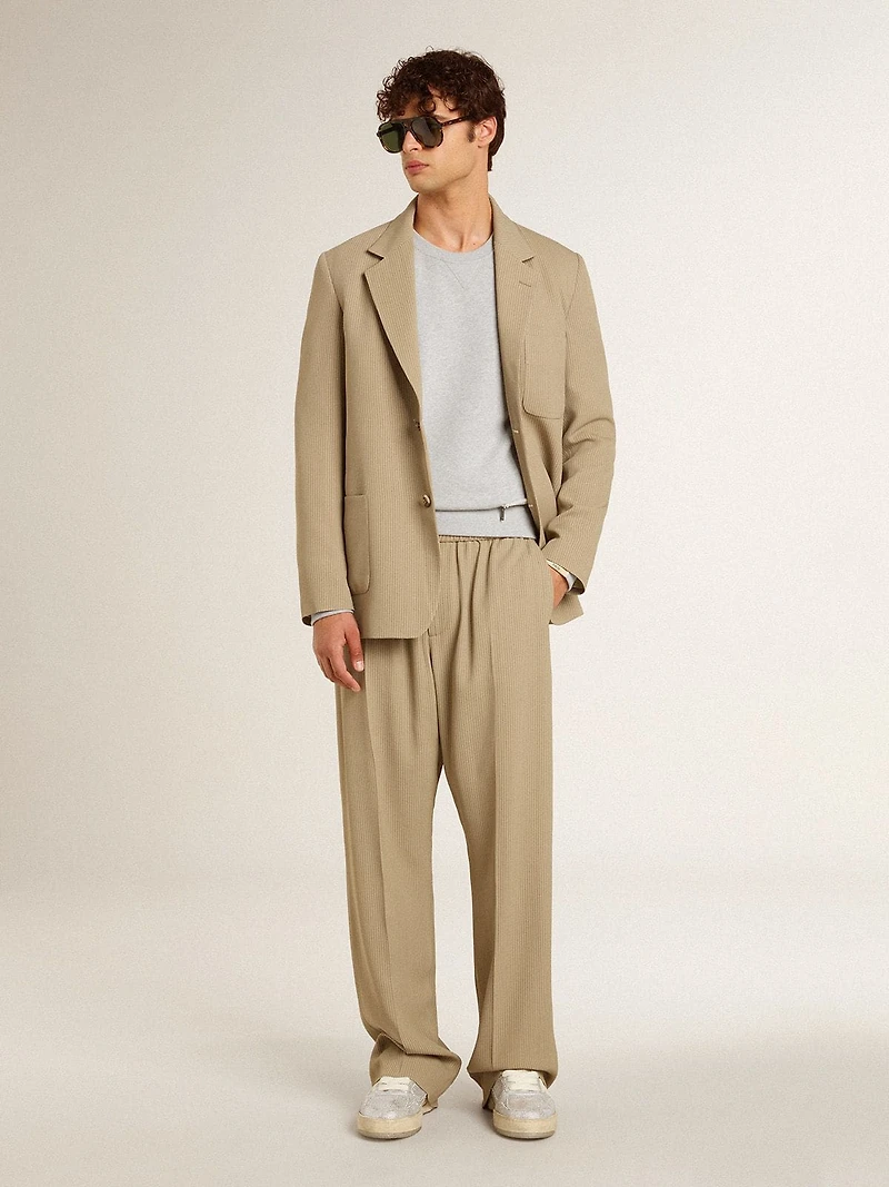 Men's beige pinstripe single-breasted jacket with an oversized fit