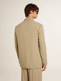 Men's beige pinstripe single-breasted jacket with an oversized fit