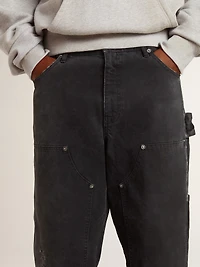 Men's distressed black cotton jeans with front patches