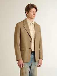 Men's single-breasted blazer a sand-colored chevron linen blend.