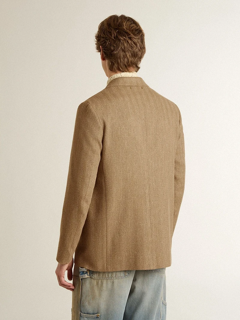 Men's single-breasted blazer a sand-colored chevron linen blend.