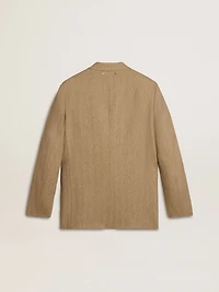 Men's single-breasted blazer a sand-colored chevron linen blend.