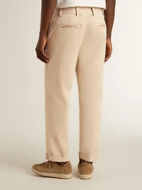 Men's beige chinos with a lived-in look finish