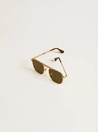 Aviator style sunglasses with gold frame and green lenses