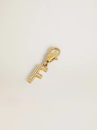 Letter F charm in gold-colored brass with crystals