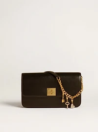 Key-shaped charm in gold-colored brass with crystals