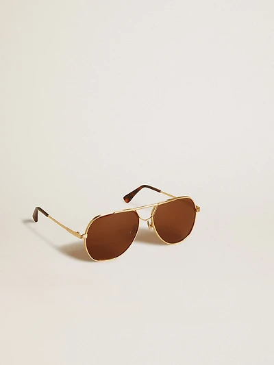 Aviator style sunglasses with gold frame and brown lenses
