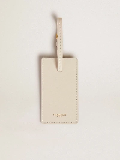 Worn white luggage tag