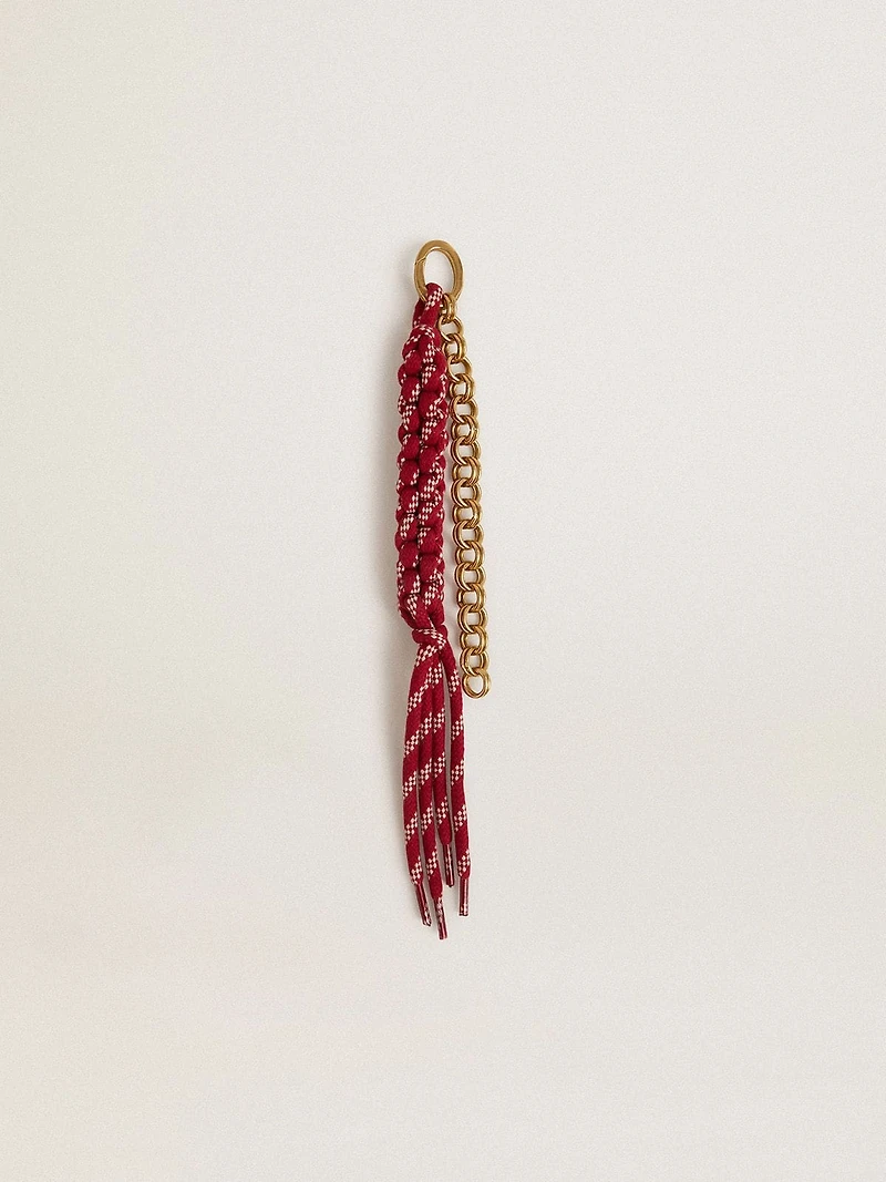 Charm with red knotted laces