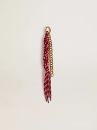 Charm with red knotted laces
