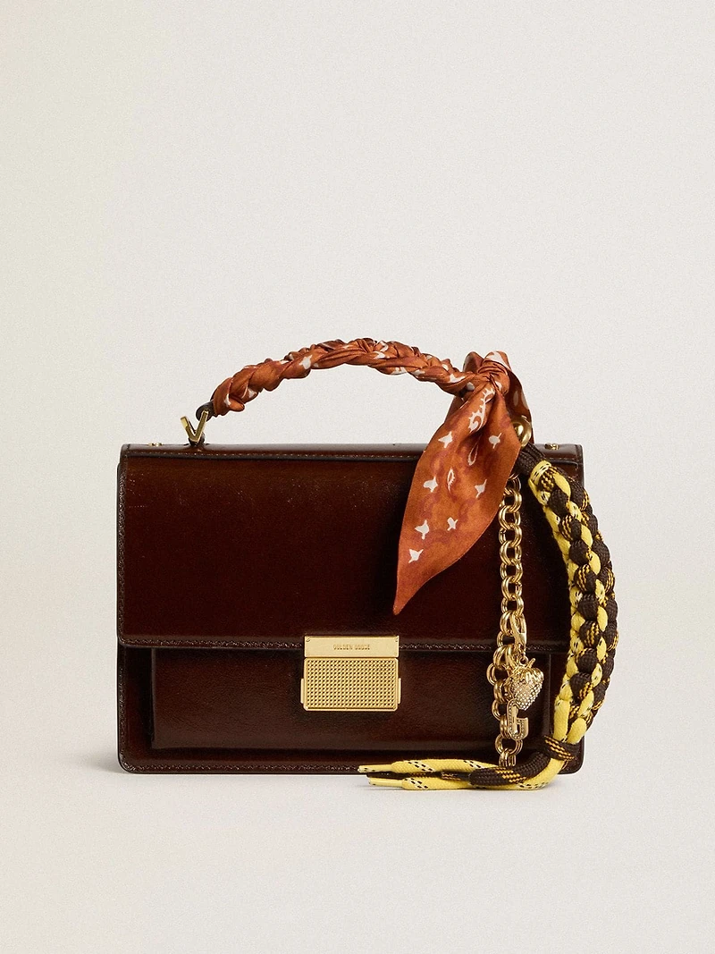 Charm with yellow and brown knotted hiking laces with chain